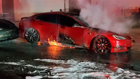 tesla battery fire in metal box safe|Why Tesla EVs Catch Fire and Why Victims Struggle to Escape.